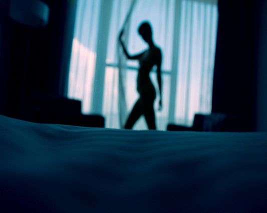 silhouette of a confident woman in the bedroom